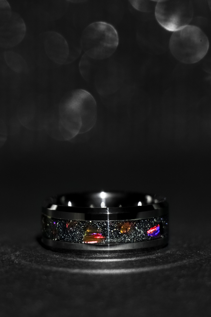 Modern inlay ring including black opals and rare silver sands of Hengam island