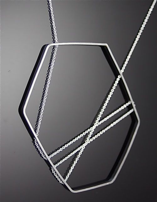 geometric pendant and silver chain