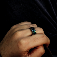 abalone and opal inlay ring on finger
